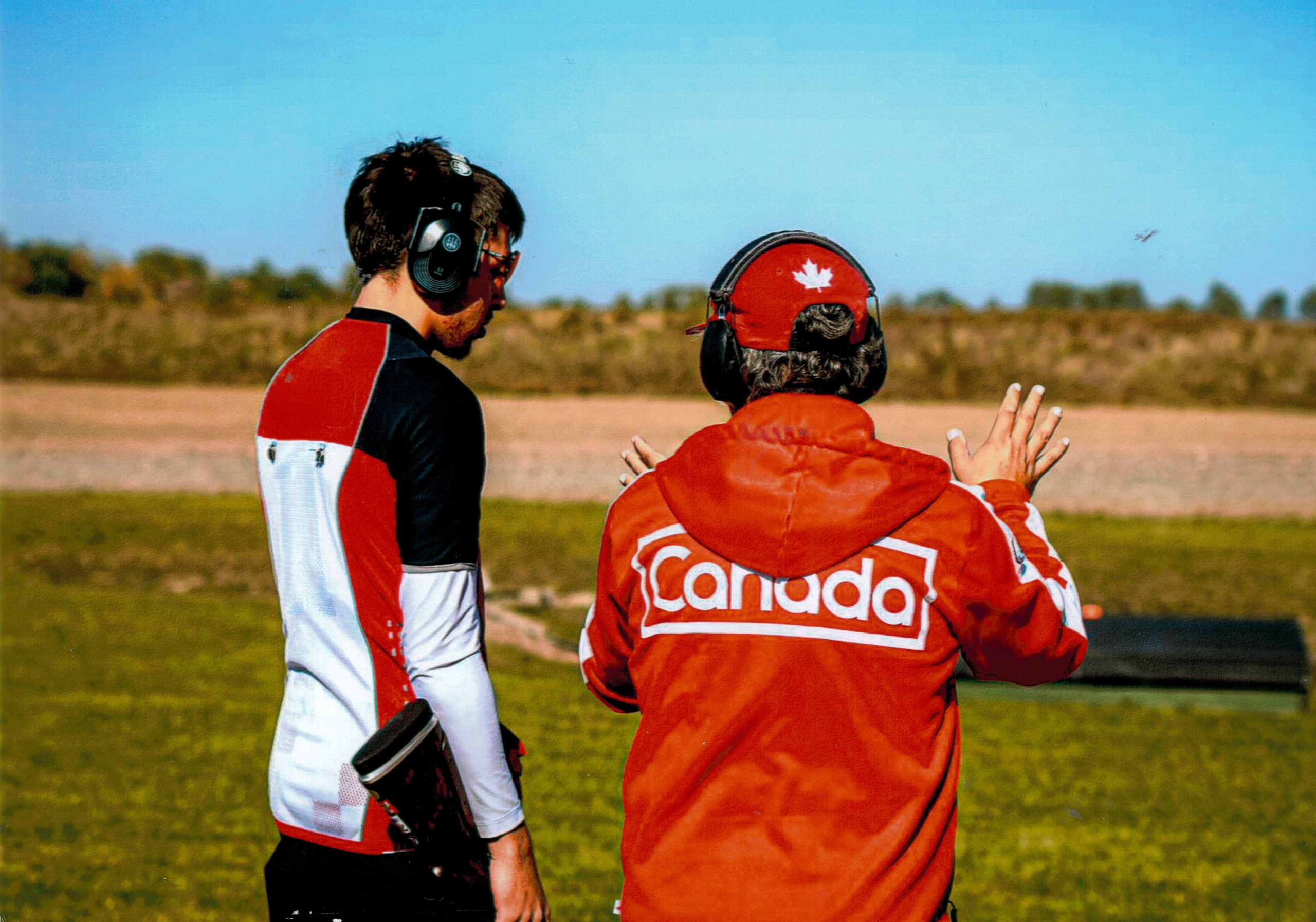 Coach working with an athlete during a Performance Development training session at the range