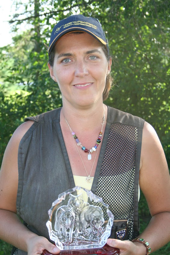 Alicia holding a competition trophy during the Academy’s 2009 season